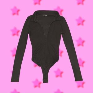 Fashion nova black long sleeve body suit. size small. worn once !